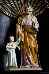 Trnava, Slovakia. 2018/4/12. A statue of Saint Joseph holding little Jesus' hand. The Saint John...