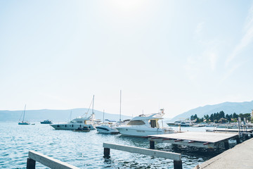 Naklejka premium boat in buy of montenegro port. summer time