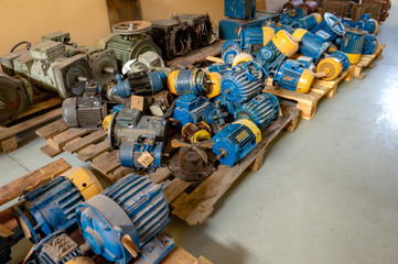 Warehouse of broken electric motors prepared for repair and restoration