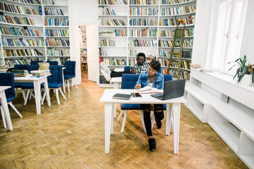 The hard-working African-American students work in the library and have a great time
