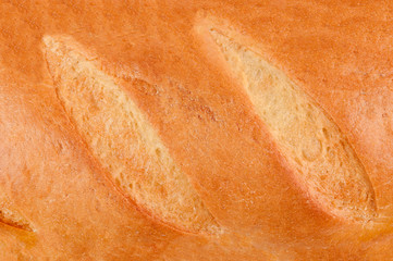 Loaf of fresh crispy bread. Top view. Background
