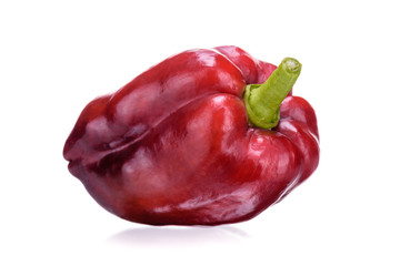 Sweet bulgarian pepper in red, close-up on a white background. Fresh juicy vegetables.