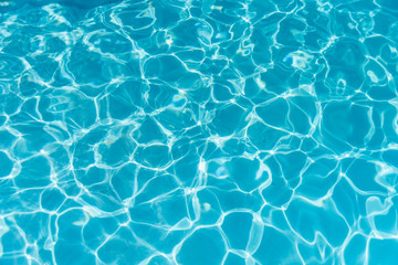 Blue ripped water in swimming pool. water surface background.