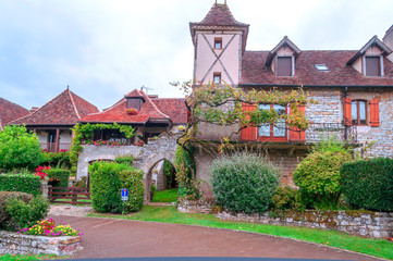 Medieval village of Aquitaine with its stone houses in the south of France on a cloudy day.