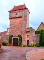 Fototapeta premium Medieval village of Aquitaine with its stone houses in the south of France on a cloudy day.