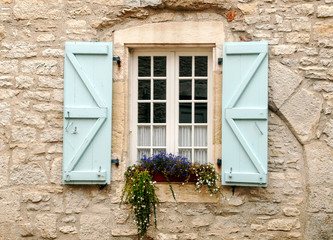 Fototapeta na wymiar Old stone facades with windows