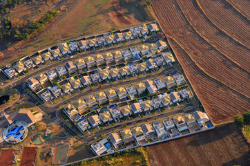 Gated community aerial view at sunrise.