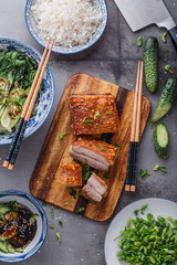 Chinese roasted pork belly on wooden cutting board