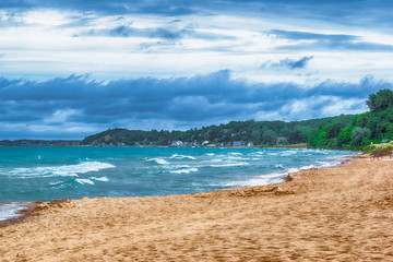 Moody clouds blowing in over the beach in Ludington Michigan