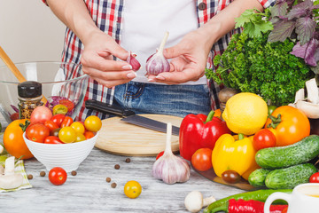Woman cooks at the kitchen, body part, blurred background