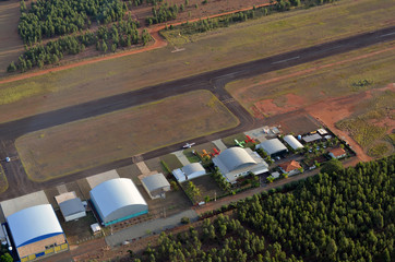 Private hangar with runway airplane, aerial view