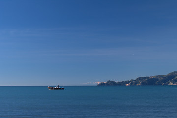 ship in the sea,promontory,italy,horizon,panorama,horizon,coast,sky,blue,water,seascape