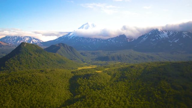 The view from the helicopter on the mountains and volcanoes of Kamchatka Krai, Russia