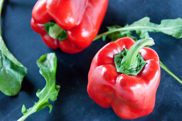 Dark food: red pepper and arugula