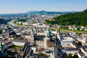 Fototapeta premium Overlooking european city with river and mountains