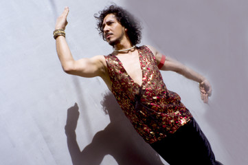 Bollywood dancer with beard and black curly hair
