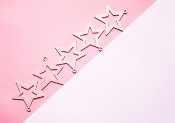 Geometric background with decorative stars. White and pink pastel colors. 