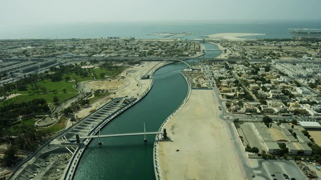 Aerial view Dubai Creek canal footbridge Safa Park