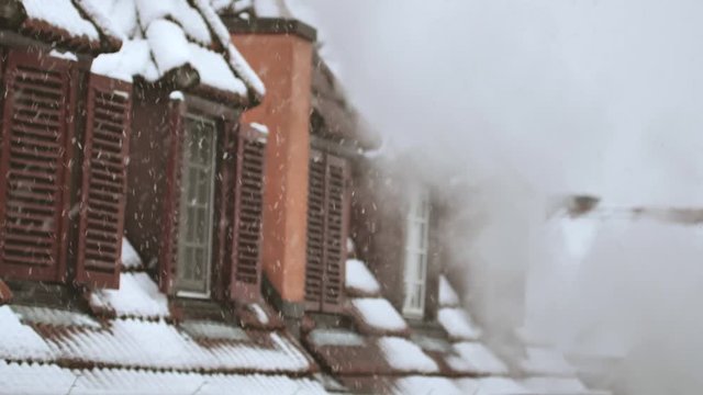 Snow on the roof. Winter scene. Winter background.Footage of Snowing