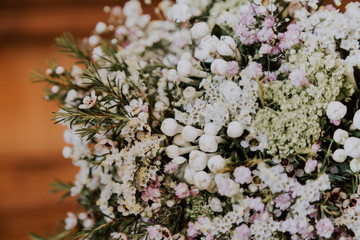 Detail of a bridal bouquet on a wooden table