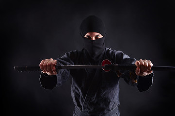 Powerful ninja portrait with katana © Dmytro