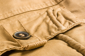 clothing items washed cotton fabric texture with seams, clasps, buttons and rivets
