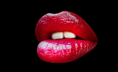 Lips with lipstick on black background. Beautiful female mouth isolated. Sexy girl. Lips icon.