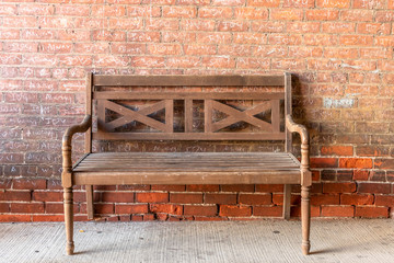 Bench against a brick wall