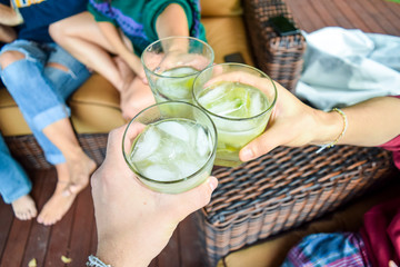 Friends toasting with Brazilian caipirinhas