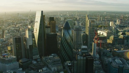 Aerial sunset view London financial district sun flare