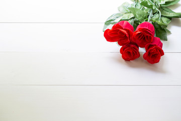 Present gift with red rose flower on wooden table, 14 February of love day with romantic, valentine holiday concept.