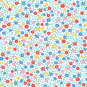 Ditsy floral seamless repeat pattern in happy bright colors and little leaves