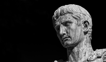 Caesar Augustus, first emperor of Ancient Rome. Old bronze statue in the Imperial Forum (Black and White with copy space) - obrazy, fototapety, plakaty