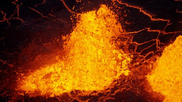 Aerial explosive molten lava spewing from erupting fissure