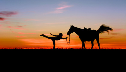 Romantic silhouette of slim toned girl and horse on bright blue sunset. Beautiful woman practicing yoga pose outdoor. Fitness, wellness and horsemanship concept on multi-colored sky background.