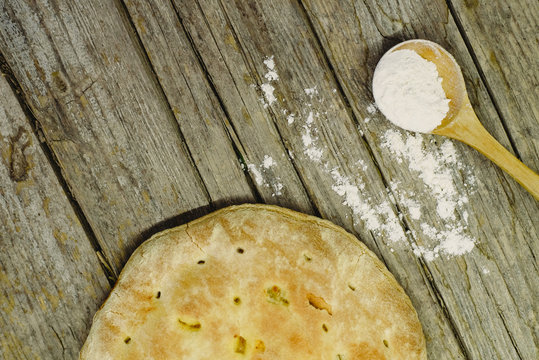 Pizza Calzone on old wooden table