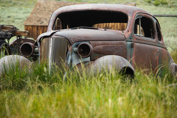 car ghost town shack grassy