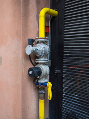 pipes and  safety valves supply natural gas to a building
