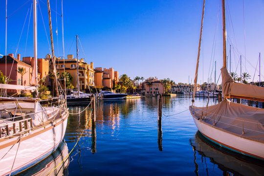 Port of Sotogrande. Port, sea, yachts and colorful houses. Sotogrande, Costa del Sol, Andalusia, Spain. Picture taken &ndash; 13 January 2019.