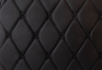 Obraz premium classic black leather Mat with straight black stitching soft leather for machine with textured pattern concept background business