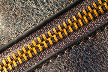 brown leather surface with stitching and zipper, background, texture, macro