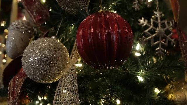 Christmas Tree ornaments close gold shiny cozy