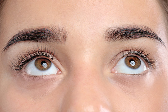 Young woman with beautiful eyelashes, closeup view