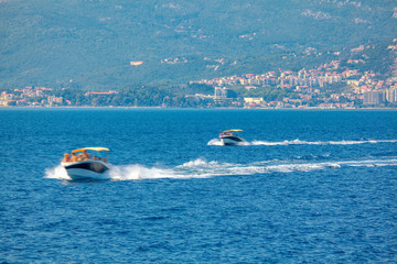 Fototapeta premium people traveling on high speed boats