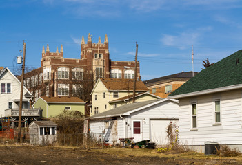 Fototapeta na wymiar Midwest town with old High School and beautiful blue skies in background.