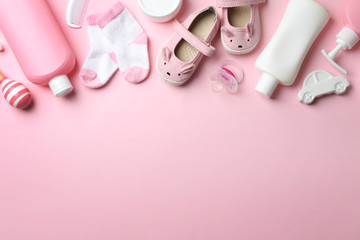 Flat lay composition with baby accessories on color background. Space for text