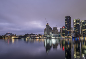 Naklejka premium dawn clouds and sydney downtown