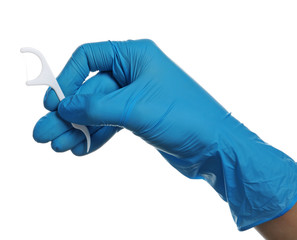 Specialist holding dental floss pick on white background. Mouth and teeth care