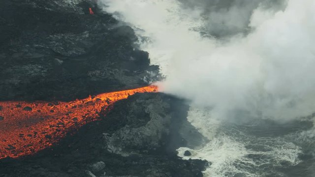 Aerial view hot lava ocean steam rising Hawaii