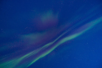 The polar arctic Northern lights aurora borealis sky star in Norway Svalbard in Longyearbyen the moon mountains